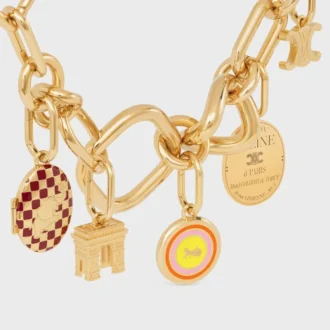 Charms Sulky Medal z emalii i mosiądzu z wykończeniem w kolorze złotym Charms Sulky Medal z emalii i mosiądzu z wykończeniem w kolorze złotym