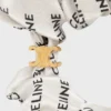 Gumka do włosów CELINE Scrunchy Rayure z jedwabiu i mosiądzu z wykończeniem w kolorze złotym Gumka do włosów CELINE Scrunchy Rayure z jedwabiu i mosiądzu z wykończeniem w kolorze złotym