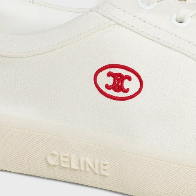 Niskie sznurowane trampki CELINE Lou z napisem Triomphe, wykonane z płótna i skóry cielęcej