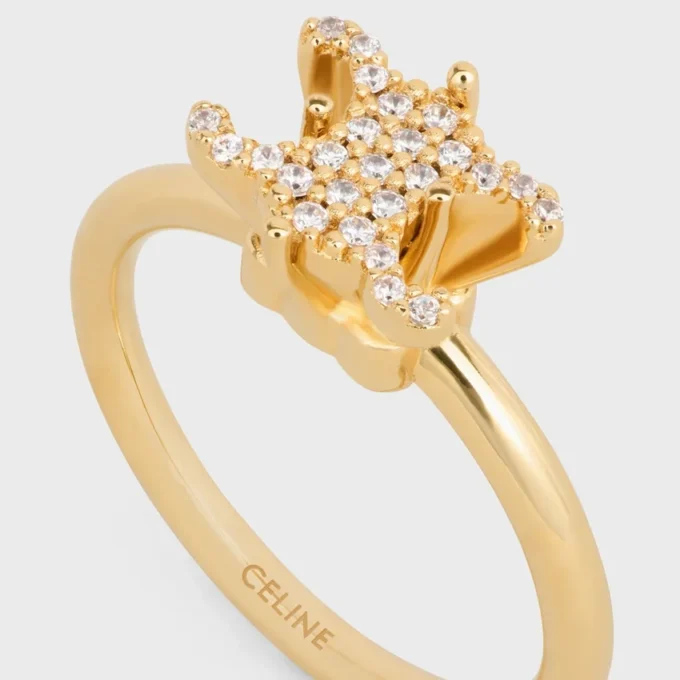 Pierścionek Triomphe Solitaire Sparkle z kryształkami i mosiądzu z wykończeniem w kolorze złotym Pierścionek Triomphe Solitaire Sparkle z kryształkami i mosiądzu z wykończeniem w kolorze złotym